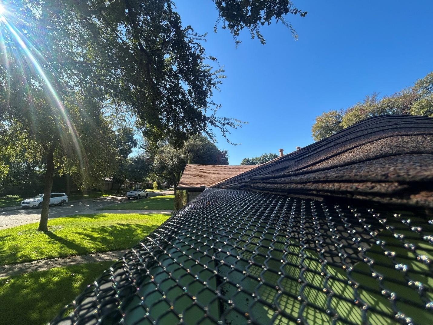 Seamless gutter with leaf protection system installed on a residential home